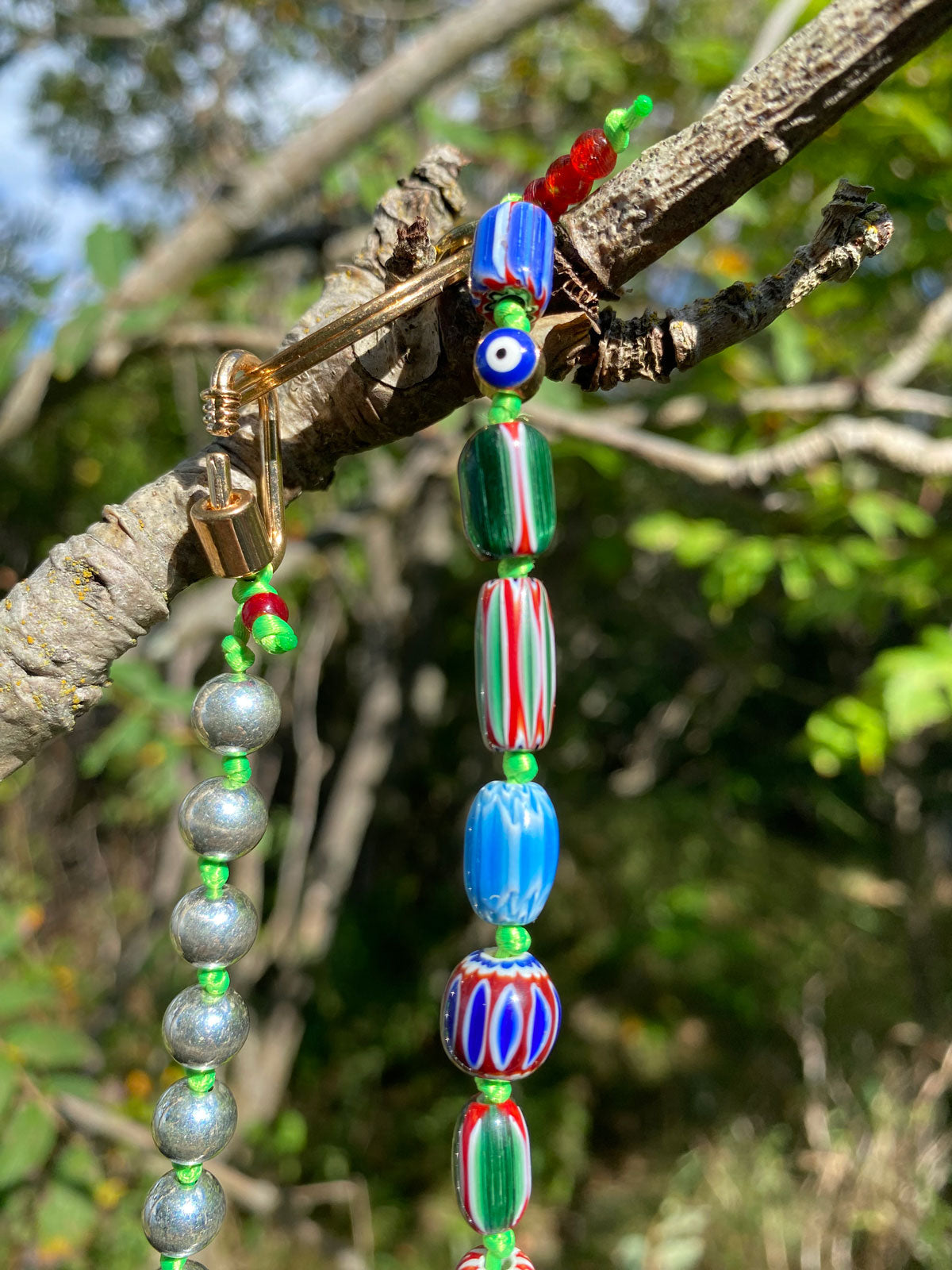 Millefiori bead keychain on green cord