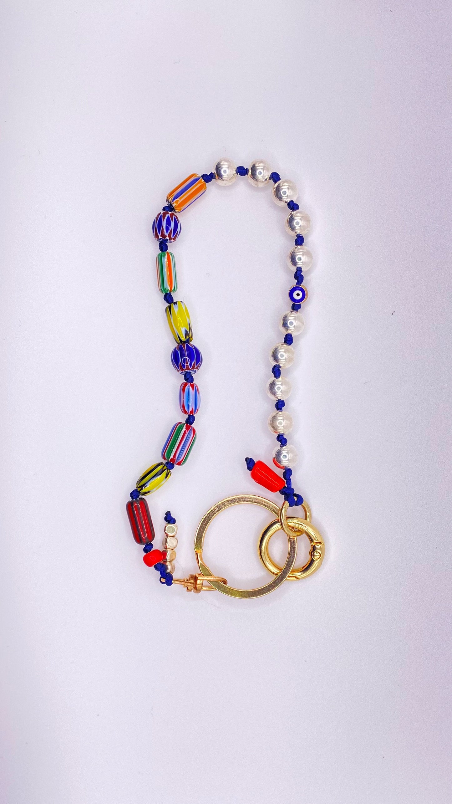 Millefiori bead keychain on navy cord
