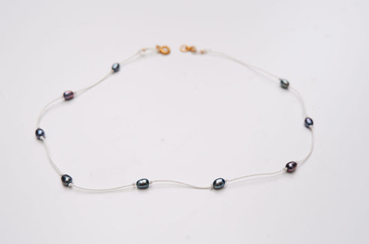 Tiny blue pearl knot necklace